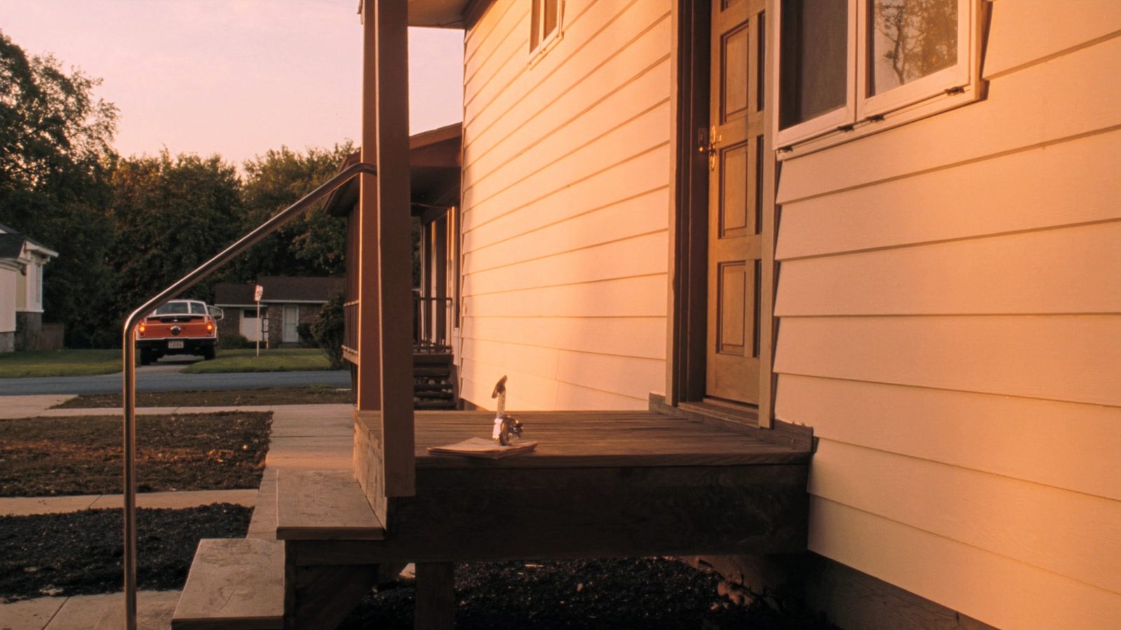 Bright, well-maintained single-family home with fresh green lawn and clear blue sky, representing a profitable after-repair value target for an investor applying the 70 percent rule in 2026