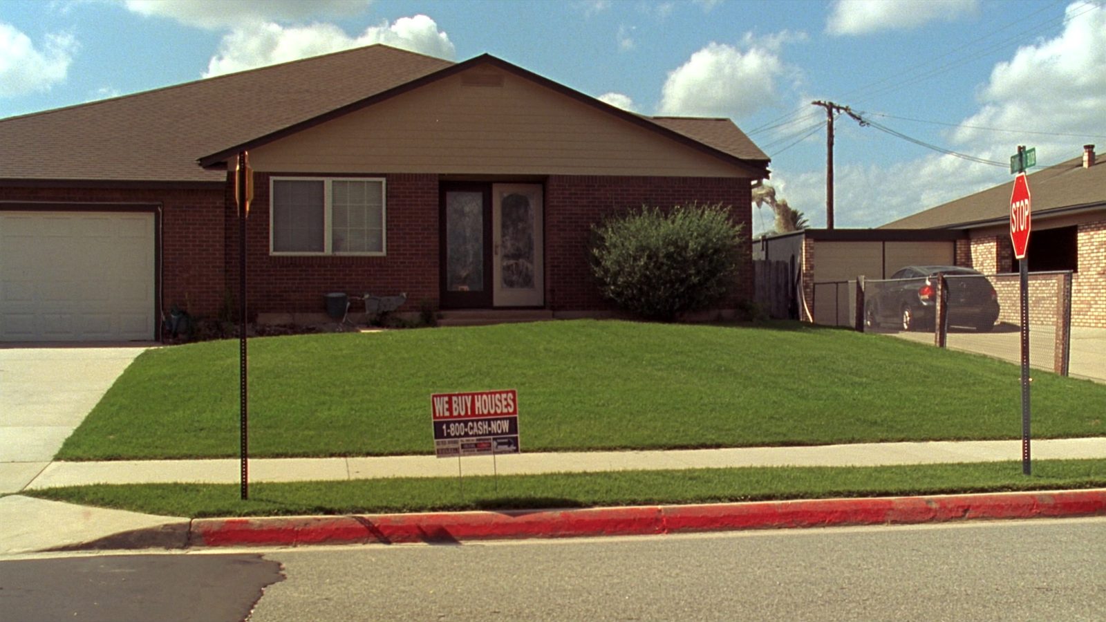 Professional real estate agent and cash home buyer reviewing property documents and house keys to make fair cash offer