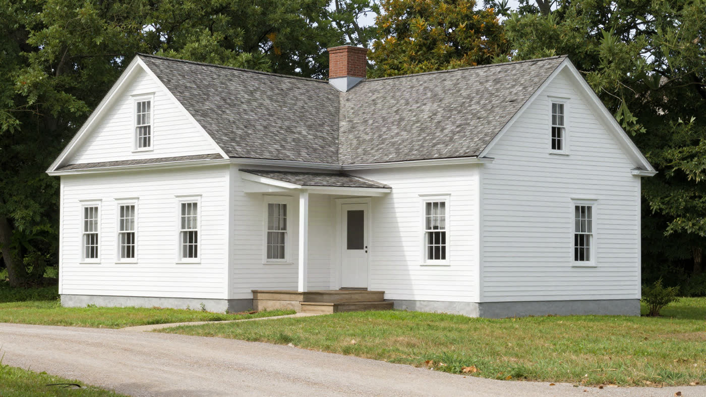 Bright, tidy single-story home with mature landscaping, the kind of paid-off Missouri house a senior can sell as-is without repairs