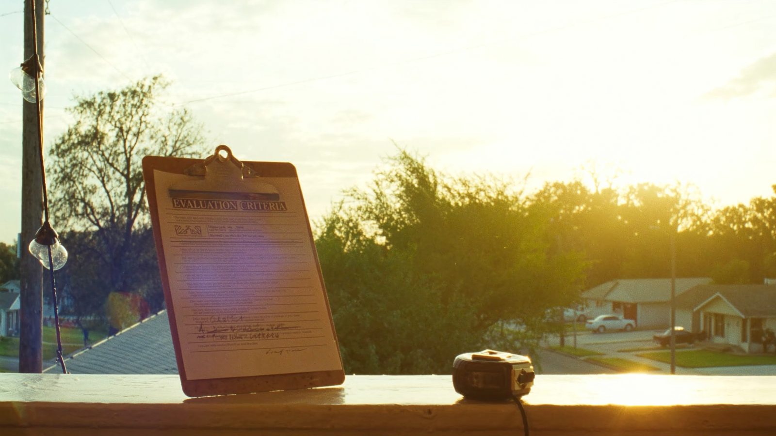 Real estate professional evaluating property documents with homeowner - cash home buyer evaluation process