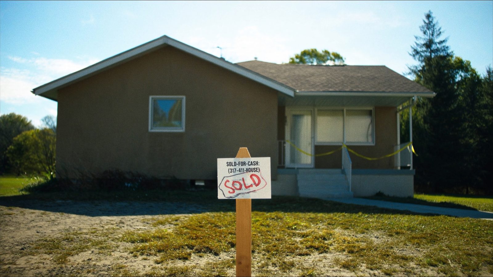 Real estate professional evaluating property documents with homeowner - cash home buyer evaluation process