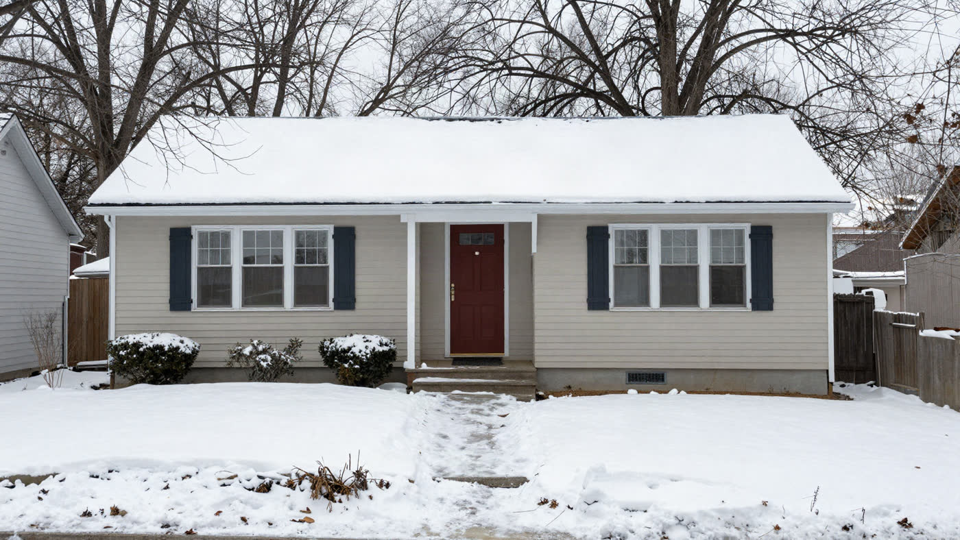 Bright brick and clapboard home with a tidy yard on a tree-lined Buffalo, New York street, the kind of property that moves through off-market investor channels