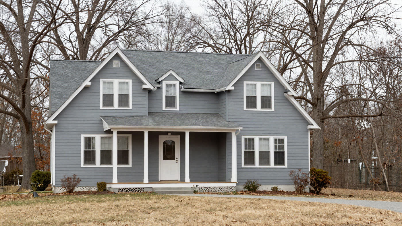 Bright, well-maintained two-story home on a tree-lined Rochester, New York street, the kind of property that moves through off-market investor channels