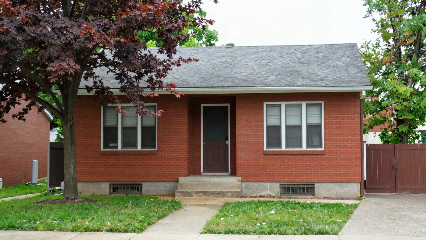 Bright, well-maintained brick two-story home on a tree-lined St. Louis, Missouri street, the kind of property that moves through off-market investor channels