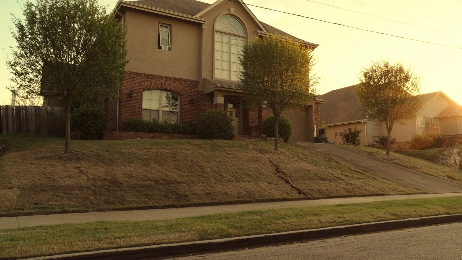 Residential home with cracks in foundation caused by Texas clay soil in Dallas