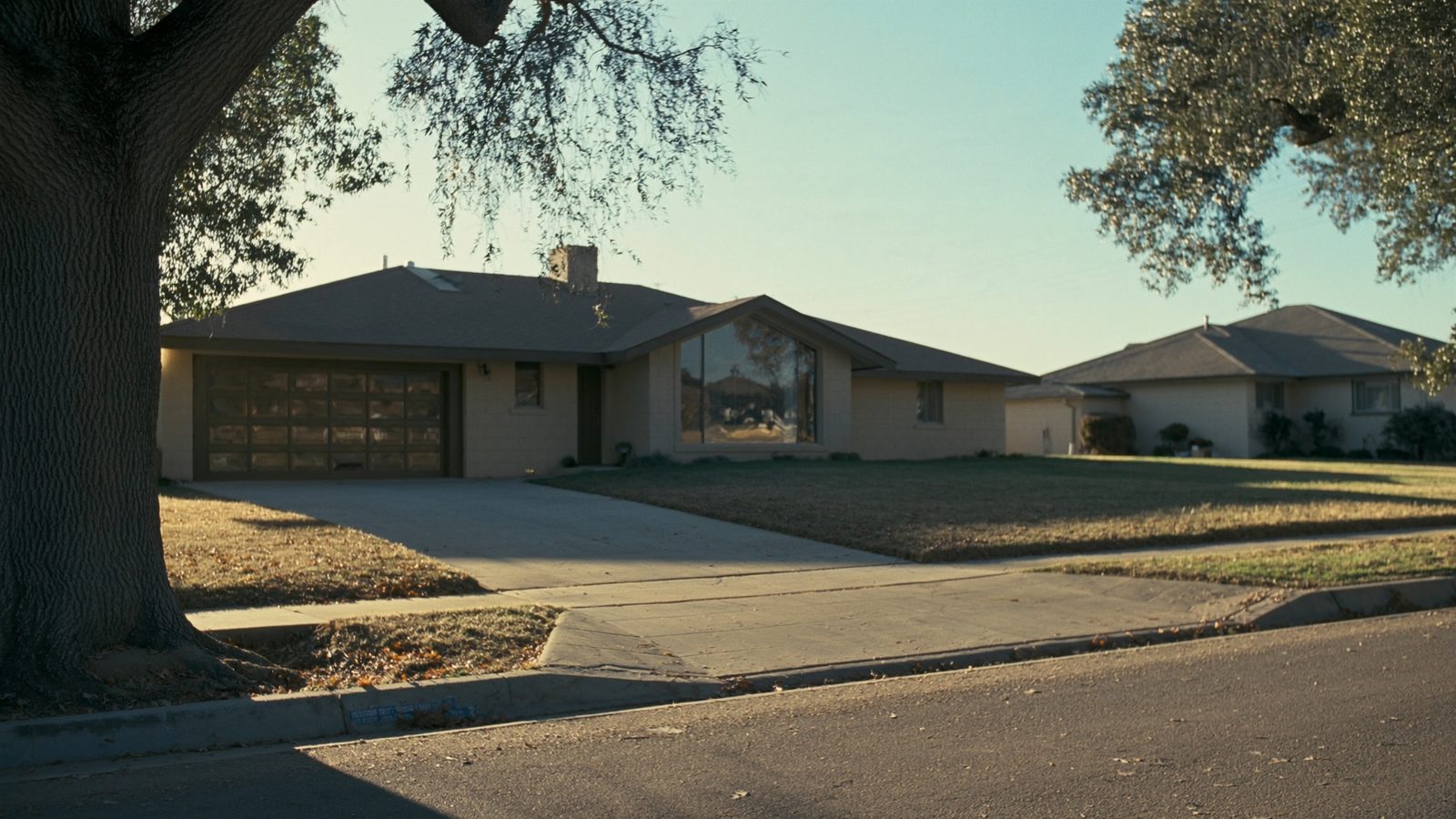 Real estate agent in Oklahoma City Oklahoma reviewing property documents and house keys to sell house fast to cash home buyers