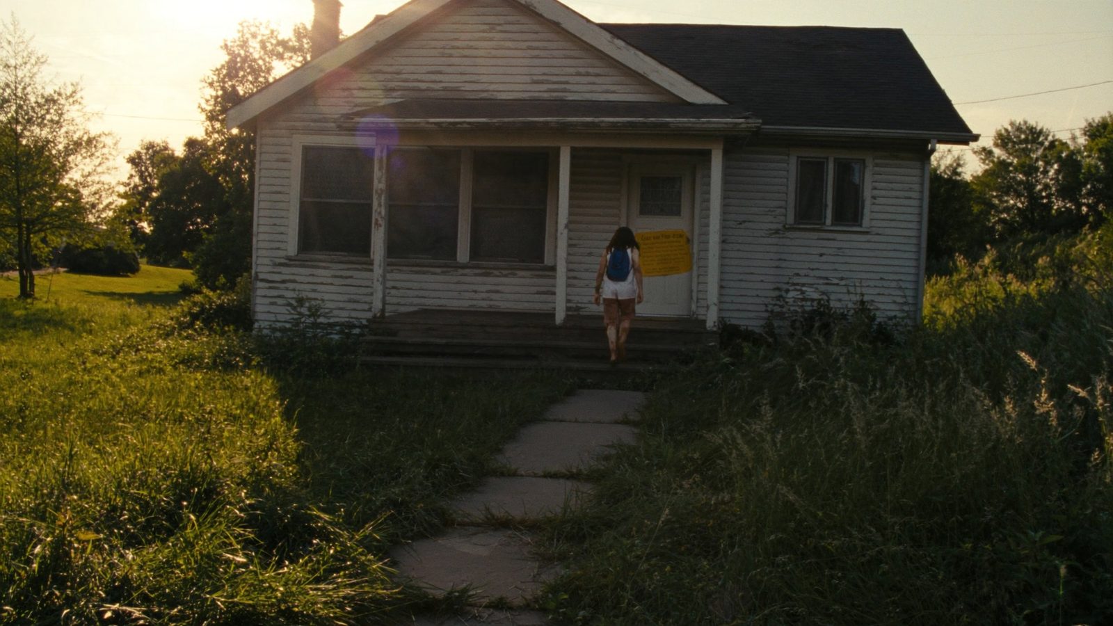 Tax delinquent property exterior in Cuyahoga County Ohio showing distressed home available at sheriff's sale