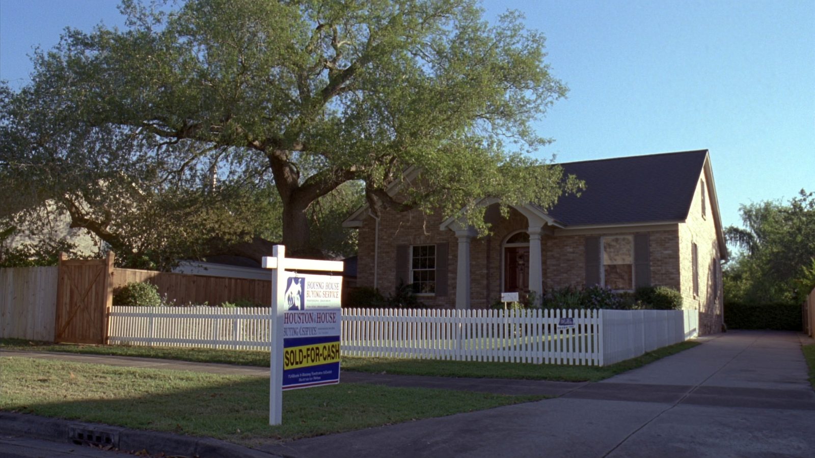 Houston, Texas suburban neighborhood at golden hour showing typical single-family homes targeted by cash buyers in Harris County in 2026