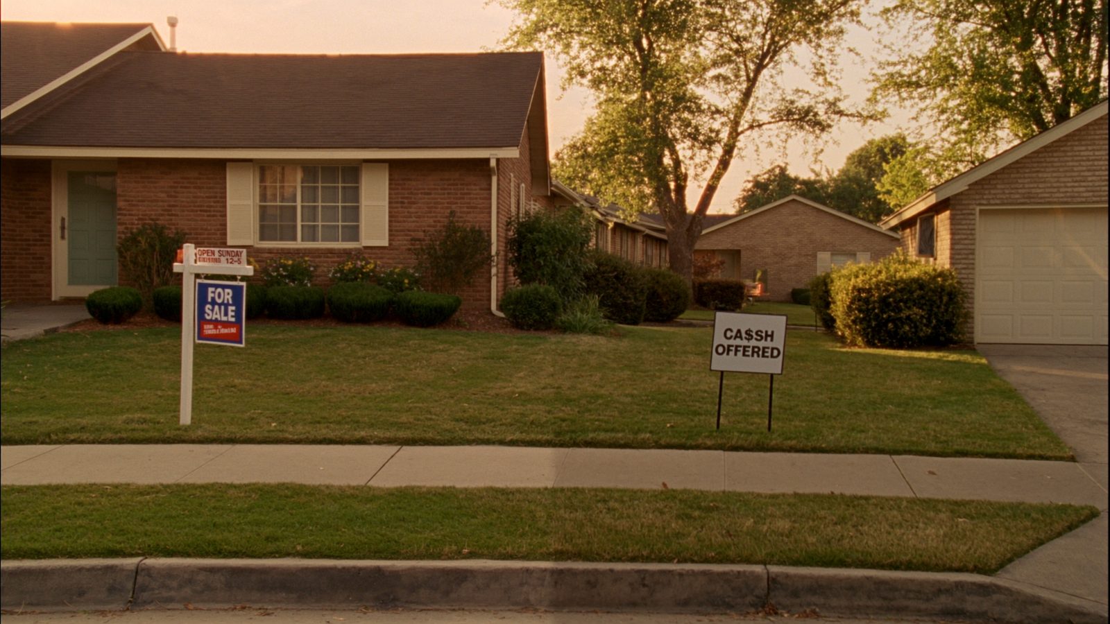 Real estate professional evaluating property documents with homeowner - cash home buyer evaluation process